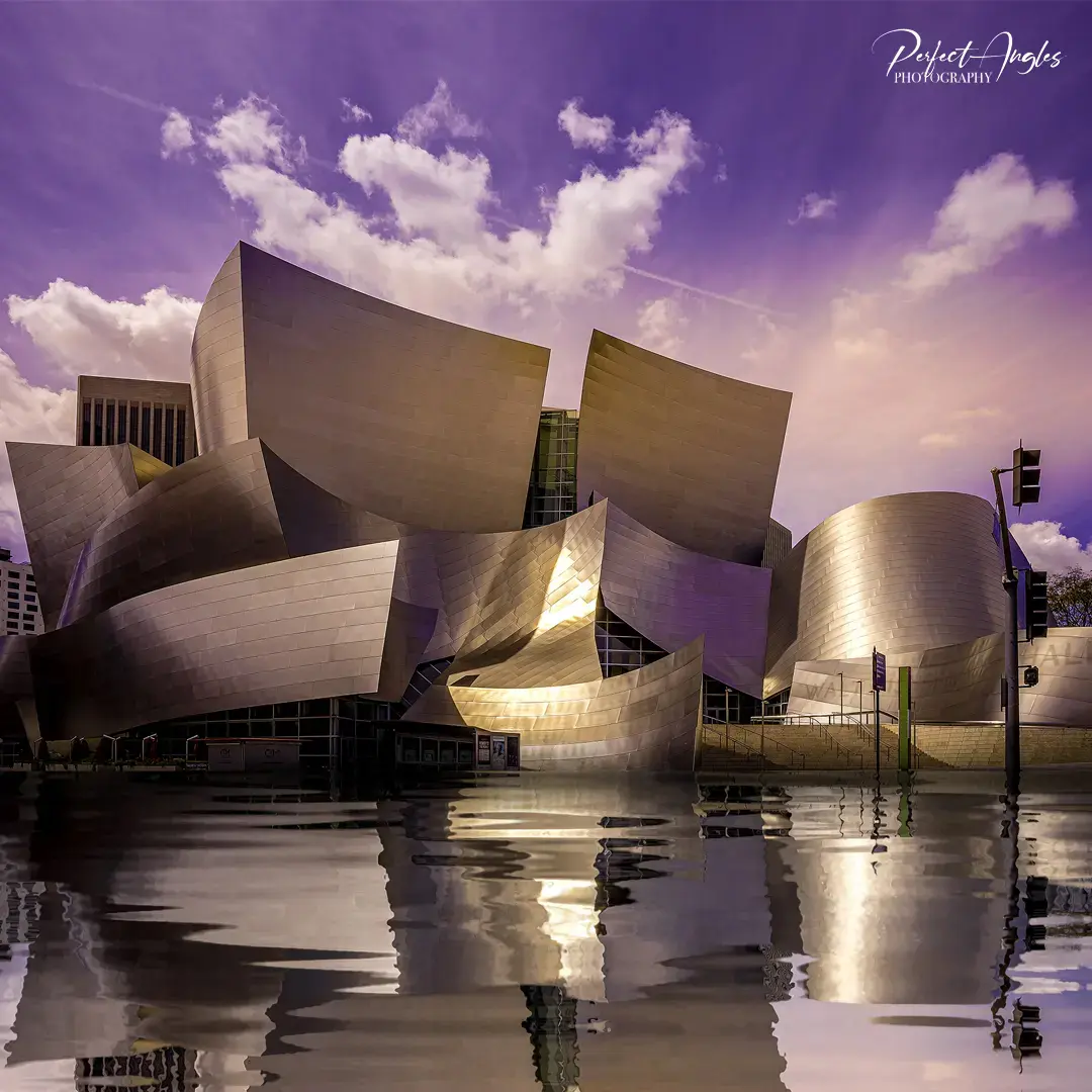 Walt Disney Concert Hall reflected in water at dusk