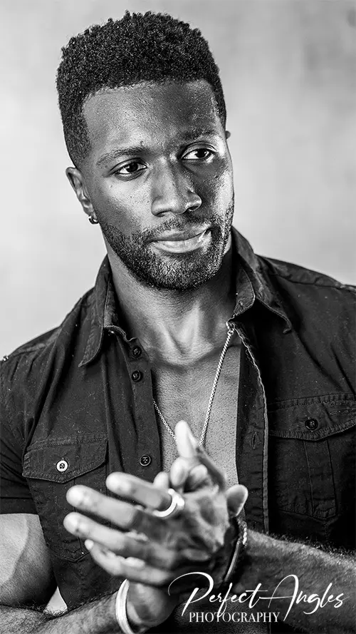 Black and white studio portrait of a man