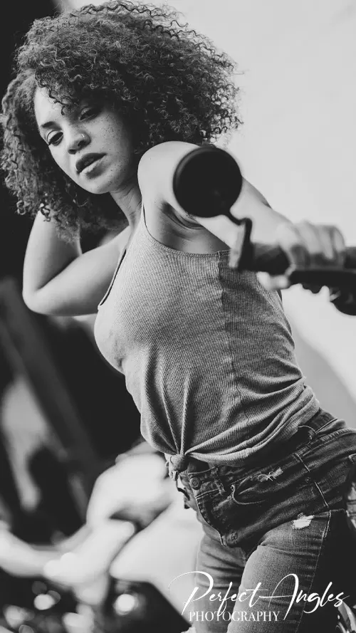 Black and white portrait of a woman with curly hair