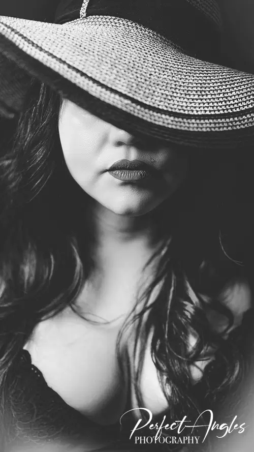 Black and white portrait study with wide-brim hat