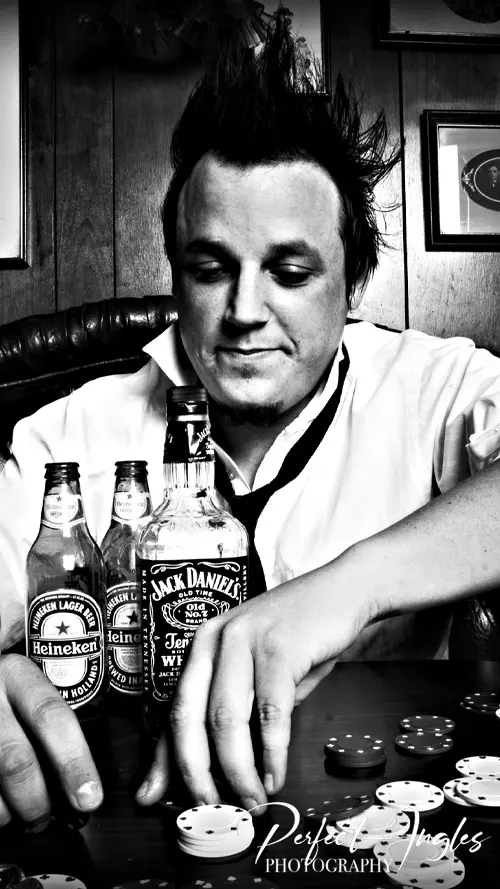 Black and white lifestyle portrait of a man at a table